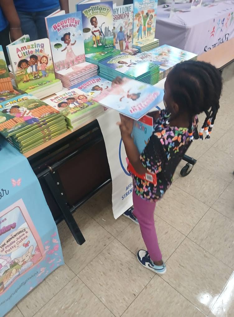 R.L. Brown Back to School Event — Student Choosing a Free Book